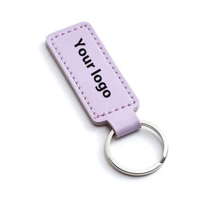 China PU white simple luxury leather custom printing logo promotional keychains for car girls bag for sale