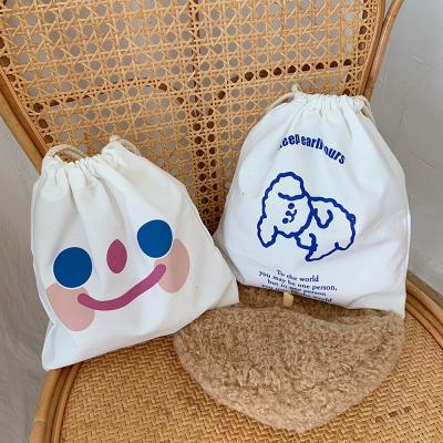 China Cute Healing Smiley Face Drawstring Tote Bag Portable Folding Drawstring Storage Bag for sale