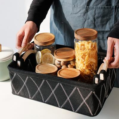 China Multifunctional Japanese style wooden handle portable desktop cosmetic snack felt storage basket for sale