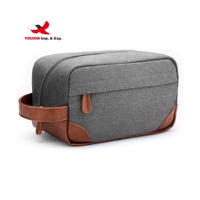 China Durable Makeup Bag in Rolling Toiletry Bag Travel Canvas Makeup Portable Cosmetic Bag Organizer with PU Leather Handle for sale