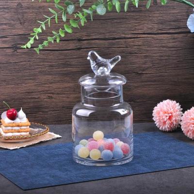 China Freshness Retention Glass Candy Jar With Bird Shaped Handle for sale