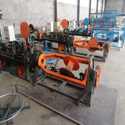 China energy & Best Price Mining Fully Automatic Twist Barbed Wire Mesh Concertina Reverse Fence Making Machine Making for sale