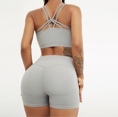 China Custom Anti-Static Logo Tight Gym Sport Bra Tops Biker Shorts Sets Women Workout Clothing Fitness And Yoga Wear for sale