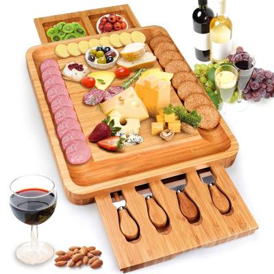 China Large Sustainable Natural Original Square, Charcuterie Wooden Bamboo Cheese Board With Fluted Cutlery 4 Stainless Steel Cheese Knives for sale