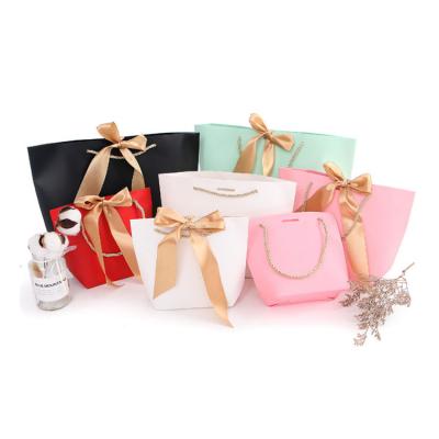 China Gift & Craft Ribbon Bow Tie Solid Color Cosmetic Packaging Jewelry Bag Gift Bags Paper Bags With Your Own Logo for sale