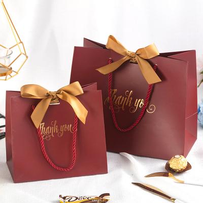 China Gift & Craft Multi Colors Wedding Fancy Bags Gift Paper Bag With Ribbon Bow for sale