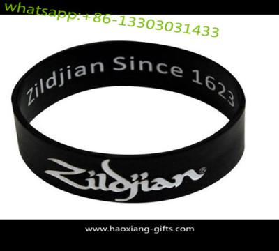 China Cheap black custom silicone bracelet / wristband  with debossed logo for sale