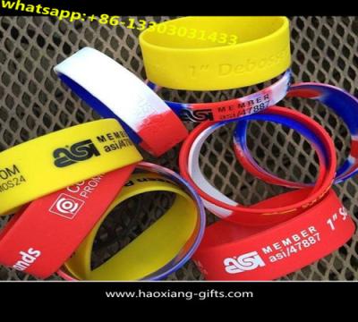 China cheap promotional silicone wristband with embossed colourful logo for sale