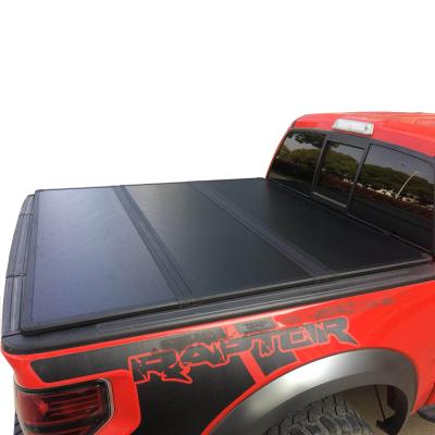 China PVC Leather 6063 Aluminum Alloy and Nylon Aluminum Hard Tonneau Cover Tri Folding Bedspread for Truck Accessories for sale