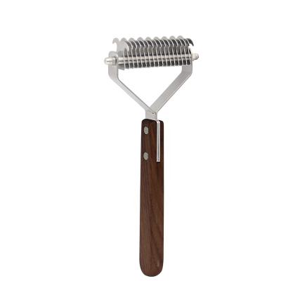 China Sustainable Pet Grooming Tool Wooden Steel Comb For Dogs And Cats Open The Knot for sale