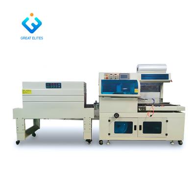 China Auto Automatic Heat Tunnel Wrap Machine Plastic Food Wrapping Shrink Wrapping Paper Wrapping Machine for sale