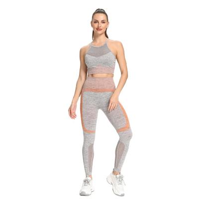 China New Arrival Anti-Static Women Workout 2 Pieces Seamless Yarn Seamless Ab Cavity Crop Yoga Top Leggings Female Weave Fitness Suits for sale