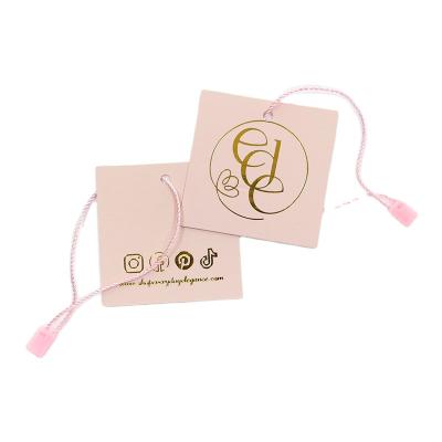 China LuxuryShiny Lamination Customized Paper Label Hang Tag Clothing Tag for sale