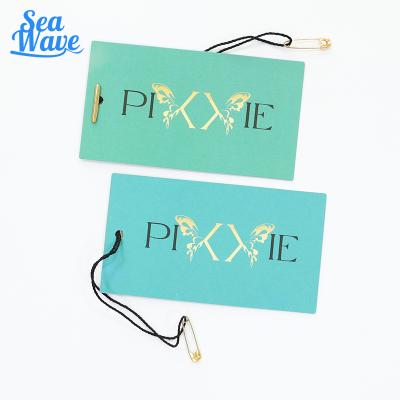 China Custom hang tag string plastic seal tag with your logo for sale