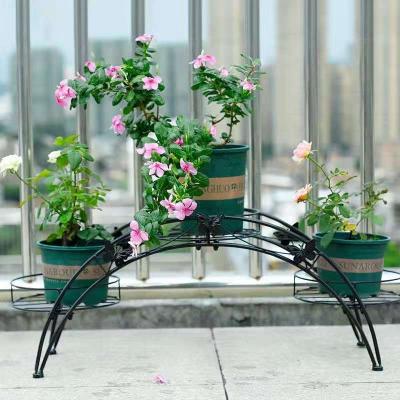 China Flower shelf home green radish shelf modern European style multi-layer indoor floor arched arched rack bracket for sale