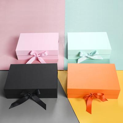 China Recycled Materials Folding Paper Gift Box Cosmetic Box Magnetic Dress Cardboard Packaging for sale