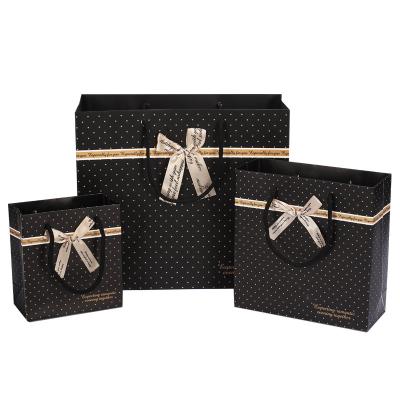 China Recycled Materials Hot Selling Custom Printed Luxury Gift Paper Shopping Gift Bags Black Paper for sale