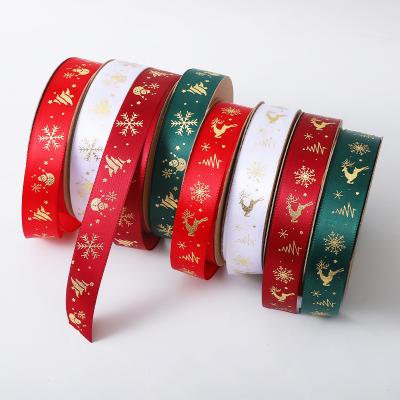 China Floral Christmas Ribbon Bow Cake Wrapping Bronzing Print Christmas Ribbon Jacquard Ribbon Wholesale for sale