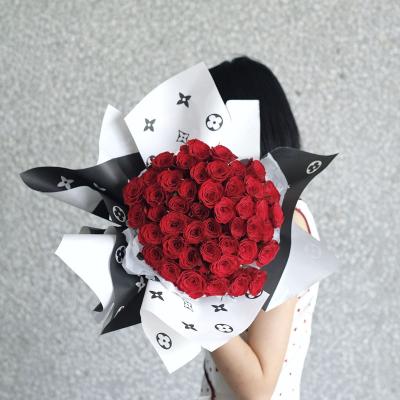 China New Waterproof Flower Wrapping Paper Flower Black And White Aristocratic Bouquet Wrapping Paper for sale