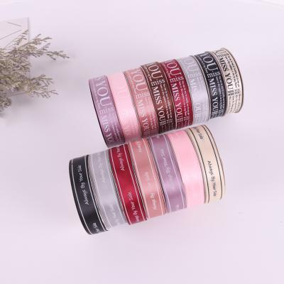 China 2.5cm Floral English Ribbon Flower Gift Box Wrapping Ribbon Bouquet Flower Wrapping Ribbon Material for sale