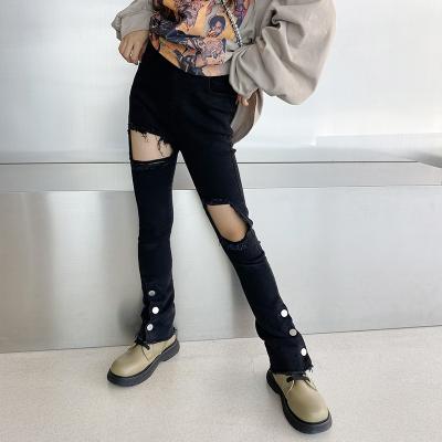 China 2021 Black New Fashion Kids Girl's Viable Stylish Button Ripped Jeans Big Hole Jeans 5-15 Years for sale