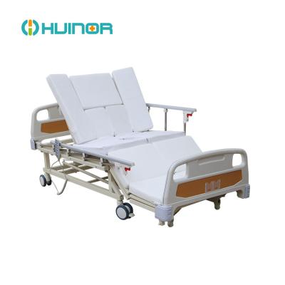 China Hospital bed humanized design electric home care to turn over bed with bedpan for sale