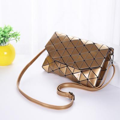 China Multifunctional Japanese Clear Luminous Handbag Golden Cosmetic Bag Cross Section Folding PVC Geometric Clutch for sale