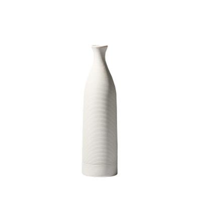 China Modern Minimalism Home Decor Hand Carving White Ceramic Flower Vase for sale