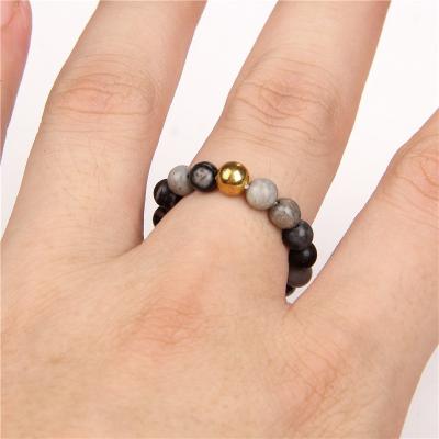 China Natural Crystal Stone Woven Bead Minimalist Ring Anti Anxiety Press Spinning Vintage Spinner Ring for sale