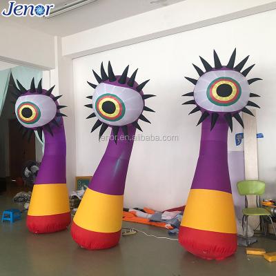 China Outdoor Party Decoration Eyes Pillar Purple Inflatable Monster With Light for sale