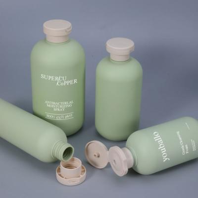 China 200ml 260ml 300ml 400ml 500ml Green Cosmetic Round Squeeze Plastic Shampoo Lotion Packaging Bottle for sale