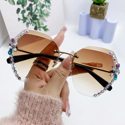 China New Women's Rimless Diamond Cut Sunglasses Ladies Protective Rhinestone UV Rimless Sunglasses for sale