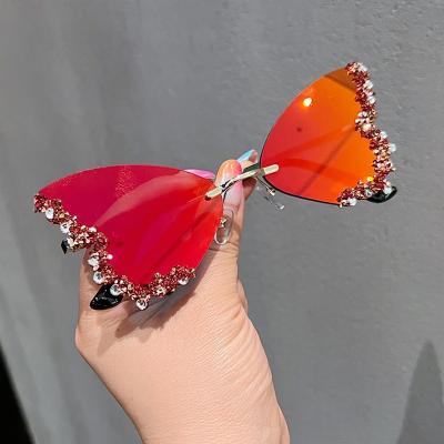 China 2023 New Luxury Rimless Sunglasses Rimless Diamond Fashion Butterfly Sunglasses Women Rhinestone for sale