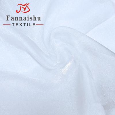 China 2020 Hot Sale 100% Nylon Shiny Crystal Organza Fabric For Wedding Anti-static Snow Dress for sale