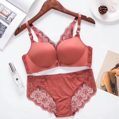 China Beautiful breathable sexy lace back no underwire button front underwear gathered breathable breasts and no trace bra and set for women for sale