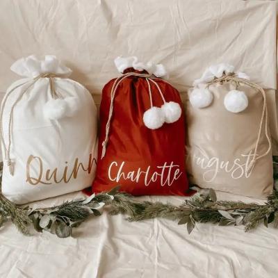 China Chirstmas Decor Holiday Santa Sack Good Quality Soft Velvet with Large Pom Pom Monogram Velvet Christmas Sacks Santa Sack with Faux Fur Lining for sale