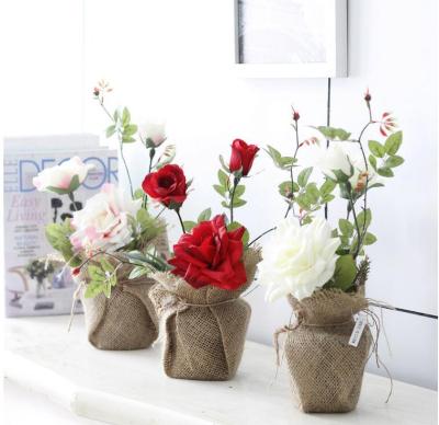 China BP063 Artificial silk and plastic rose flower with canvas bag outside fashion plastic pot plants even plastic home decorations for sale