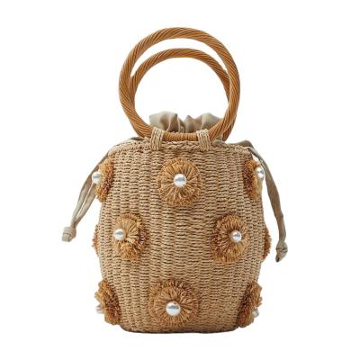 China Fashion Handbags 2022 New Arrival Pearl Decorative Handmade Basket Woven Bags Straw Bags for sale