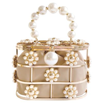 China Luxury Metal Designer Alloy Cage Pearl Flower Dinner Handbags And Purses For Ladies Wedding Party Clutch Hollow Out Wire Basket for sale