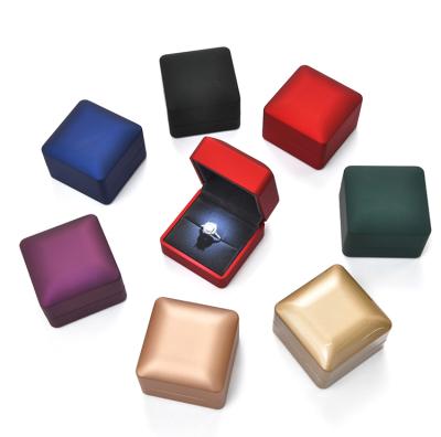 China Luxury OEM/ODM PU Leather Jewelry Pendant Packaging Led Wedding Ring Box Display With Light Velvet for sale