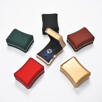 China Luxury Custom PU Leather Ring Pendant Packaging Led Light Leather Jewelry Ring Box Led Light Jewelry Box Packaging for sale