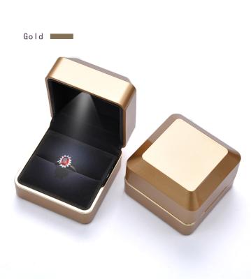 China Luxury Custom PU Leather Ring Pendant Packaging Led Light Leather Jewelry Ring Box Led Light Jewelry Box Packaging for sale