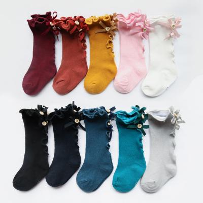 China QUICK DRY Autumn Kid Socks With Bow lace button baby socks cotton tube girls kids long socks for sale