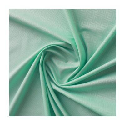 China Custom Soft Green Memory Plain Weave Brushed Embossed Polyester Fabric for sale