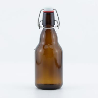 China Amber Glass Beverage 330ml Swing Top Beer Bottle With Buckle Lid for sale