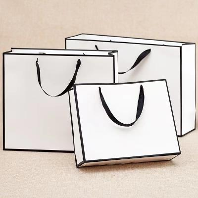 China Recyclable Custom Luxury Garment Gift Paper Shopping Bags With Logo Print for sale