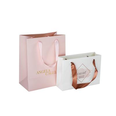 China Luxury Custom Logo Materials Recycled Shopping Paper Bag With Polyester Satin Ribbon Handle Gift Bags for sale