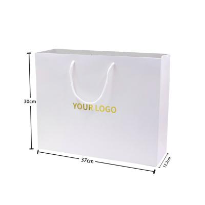 China High Quality Handmade Logo Printed Heavy Duty Gold Foil White Card Packaging Paper Bags Shopping With Your Own Logo for sale