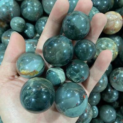 China Natural Crystal Ball Europe Nature Dragon Blood Stone Spheres For Sale for sale