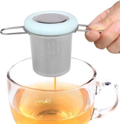 China WITH LID Folding Handle Tea Filter Good Mesh Strainer Brewing Basket With Silicone Lid For Loose Leaf Tea for sale